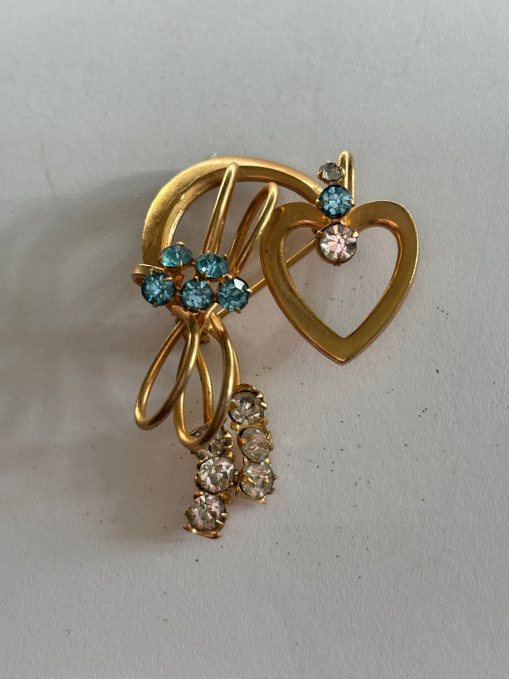 Vintage gold toned Heart & Rhinestone Brooch with Blue Accents.